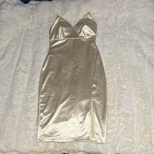 A size small Guess dress the color is a silky off white dress